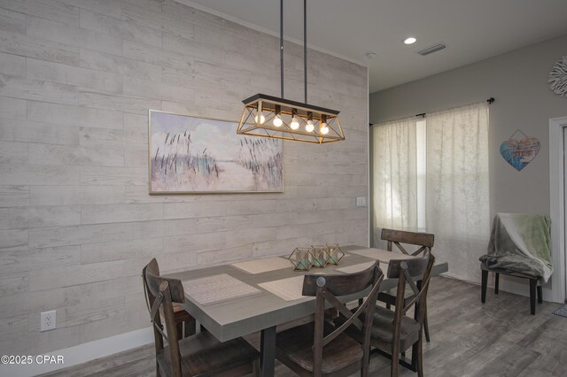 112 Riviera Dr, Panama City Beach, FL 32413 - dining room featuring wood finished floors, a chandelier, and recessed lighting