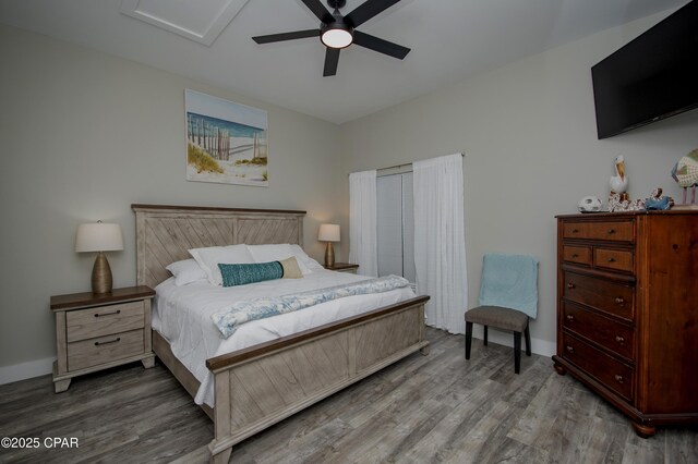 112 Riviera Dr, Panama City Beach, FL 32413 - bedroom with wood finished floors, a ceiling fan, and baseboards