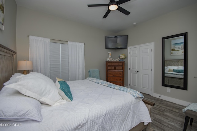 112 Riviera Dr, Panama City Beach, FL 32413 - bedroom with wood finished floors, baseboards, a closet, and a ceiling fan