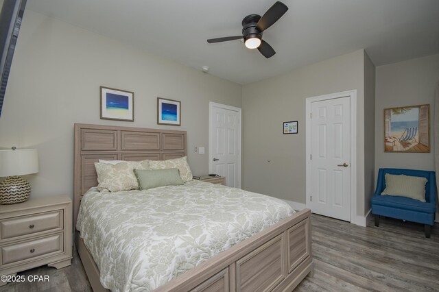 112 Riviera Dr, Panama City Beach, FL 32413 - bedroom with wood finished floors and ceiling fan