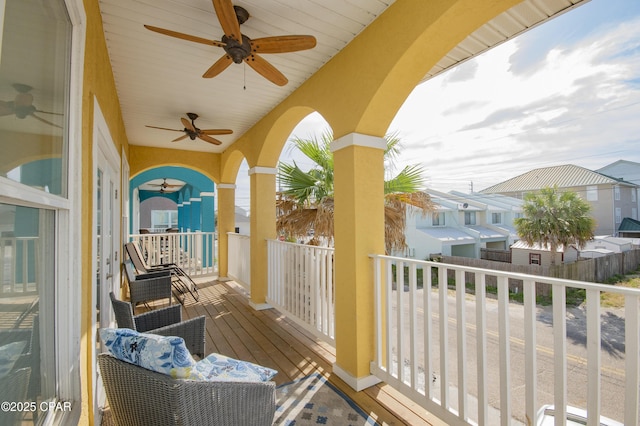 112 Riviera Dr, Panama City Beach, FL 32413 - wooden deck featuring ceiling fan and a residential view