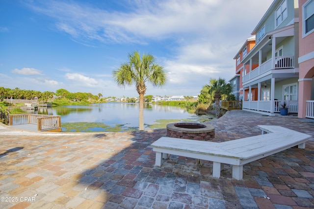 112 Riviera Dr, Panama City Beach, FL 32413 - view of patio / terrace with a water view and a fire pit