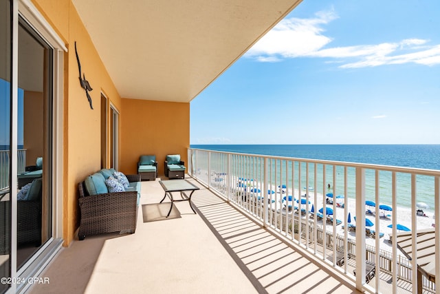 balcony with a view of the beach and a water view