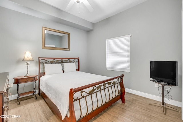 bedroom with ceiling fan and light hardwood / wood-style flooring