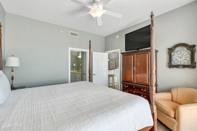 bedroom with ceiling fan, light hardwood / wood-style flooring, and connected bathroom