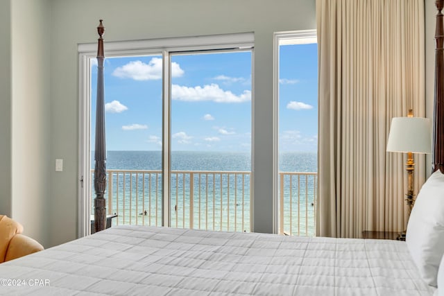 bedroom featuring a water view