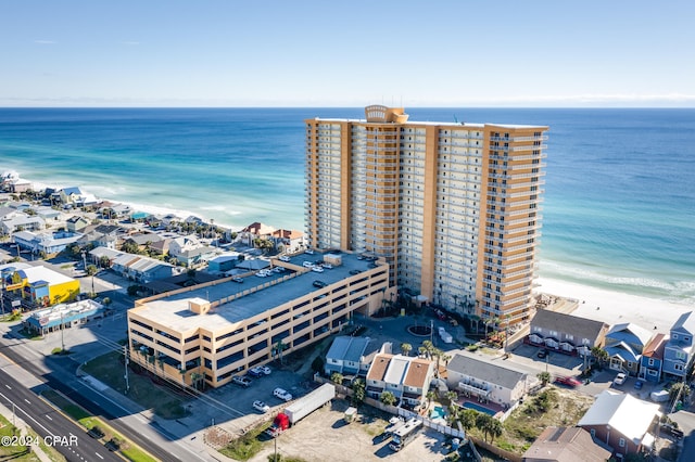 birds eye view of property featuring a water view and a view of the beach