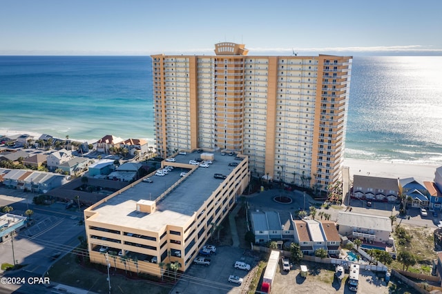 drone / aerial view with a water view and a view of the beach