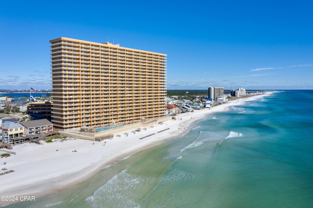 birds eye view of property with a city view, a beach view, and a water view