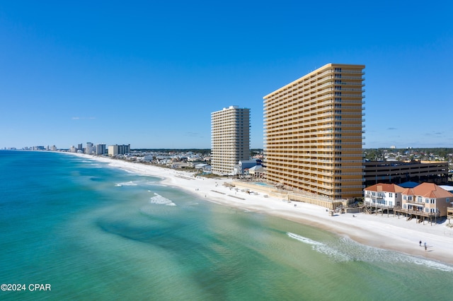 aerial view featuring a view of the beach and a water view