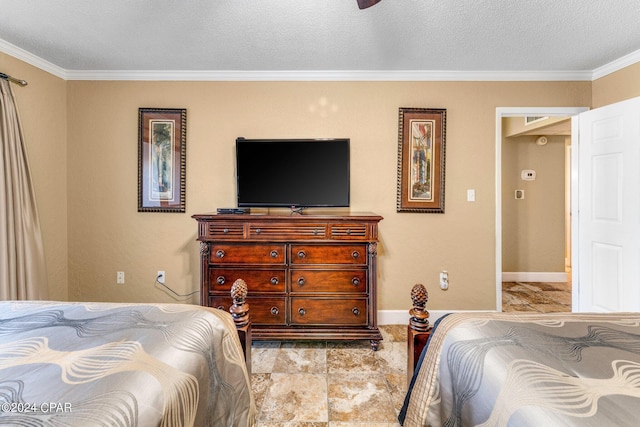bedroom featuring baseboards, crown molding, and a textured ceiling