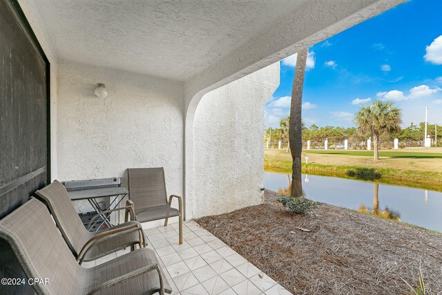 view of patio / terrace featuring a water view