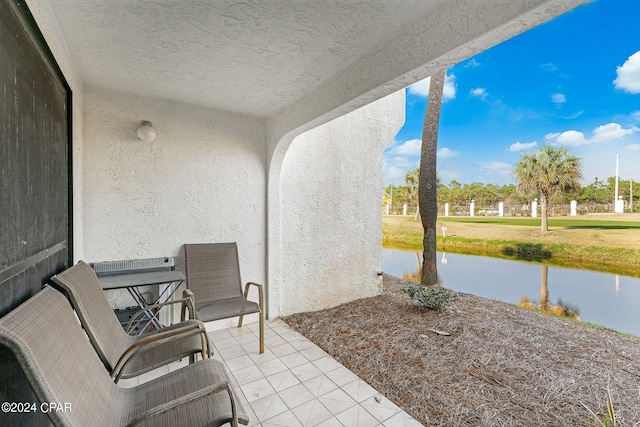 view of patio / terrace featuring a water view