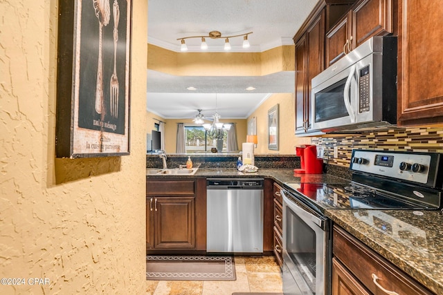 kitchen featuring a sink, tasteful backsplash, appliances with stainless steel finishes, and crown molding