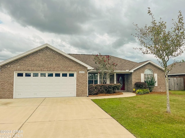 ranch-style house with a front yard and a garage