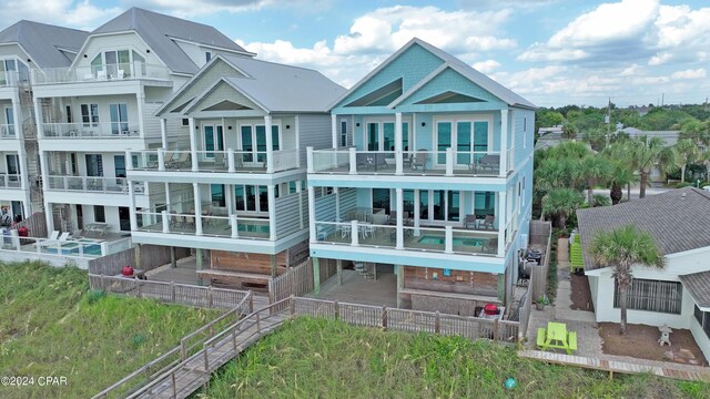 rear view of house featuring a balcony