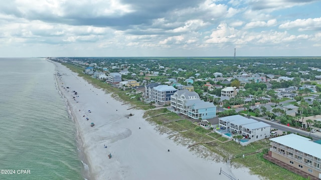 bird's eye view with a water view and a view of the beach