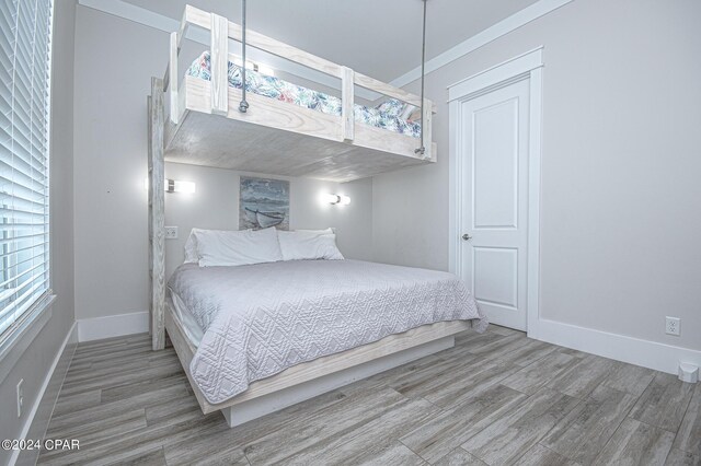 bedroom with wood-type flooring