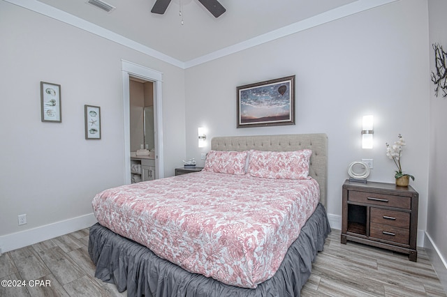 bedroom with ornamental molding, ensuite bath, ceiling fan, and light hardwood / wood-style floors