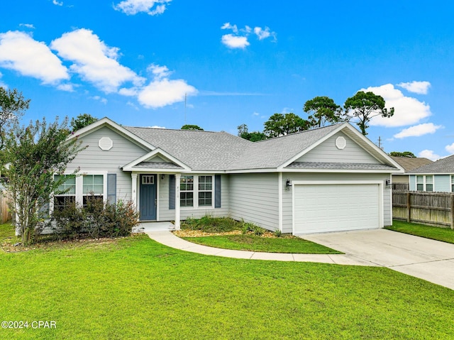 ranch-style home with a front yard and a garage