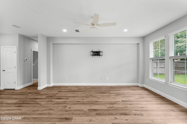 unfurnished room featuring ceiling fan and light hardwood / wood-style flooring