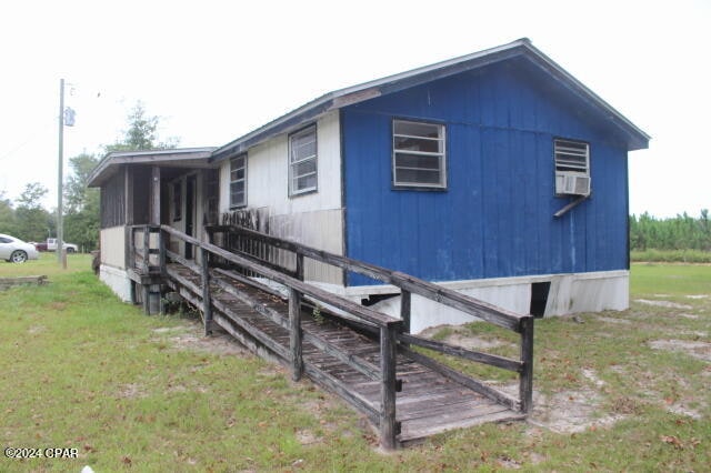 view of property exterior with a yard