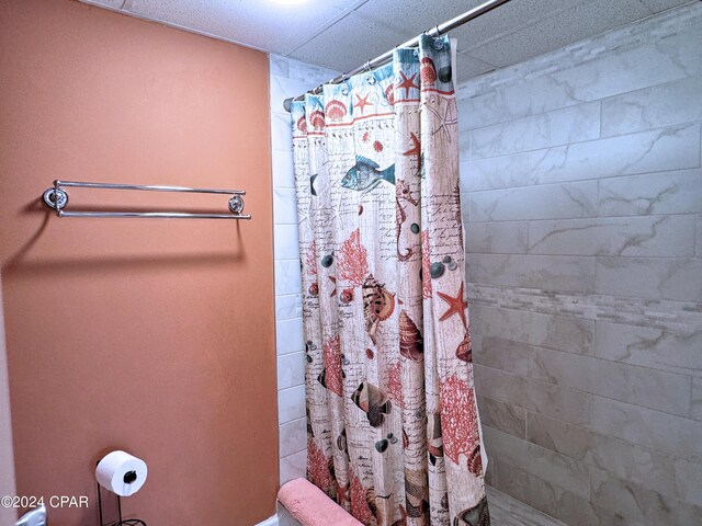 bathroom with a shower with shower curtain