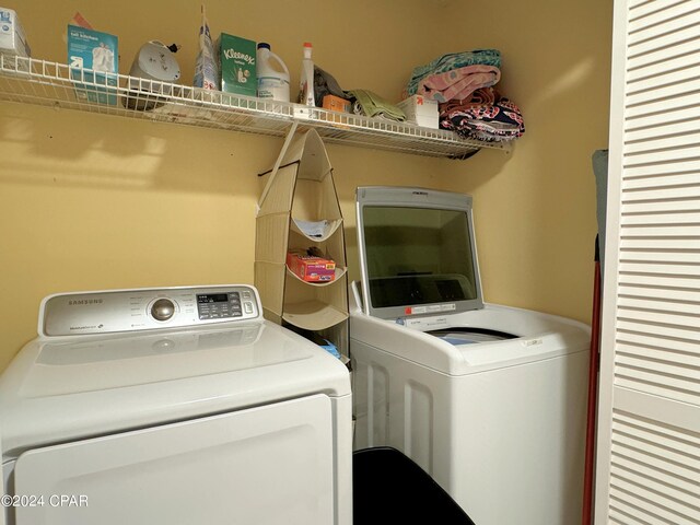 kitchen featuring white refrigerator and a textured ceiling