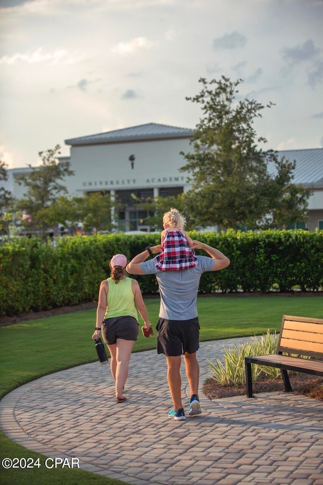 view of home's community featuring a lawn