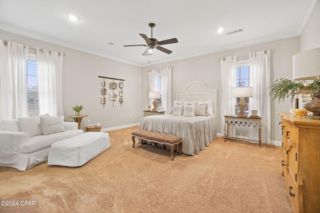 bedroom featuring light carpet, ceiling fan, and crown molding