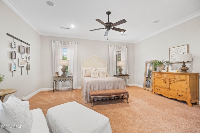 carpeted bedroom with crown molding and ceiling fan