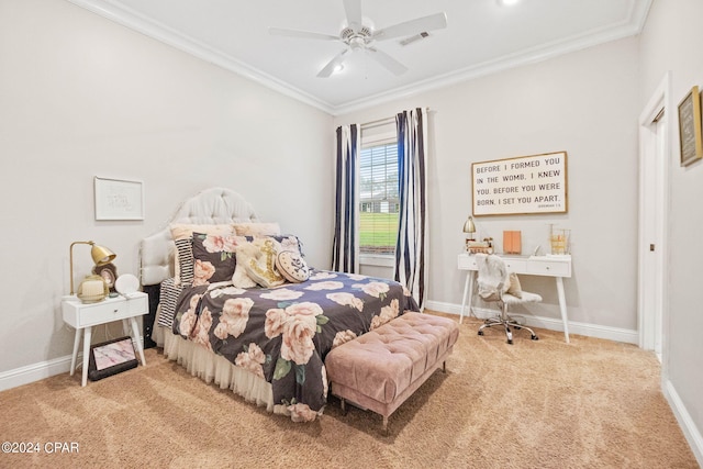 carpeted bedroom featuring crown molding and ceiling fan