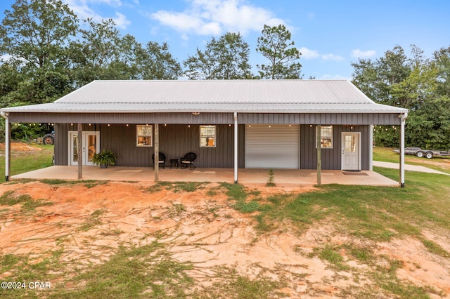 rear view of property featuring a patio