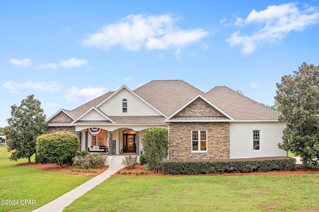 craftsman-style home featuring a front yard