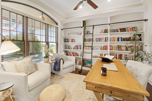 home office featuring ceiling fan, hardwood / wood-style flooring, and crown molding