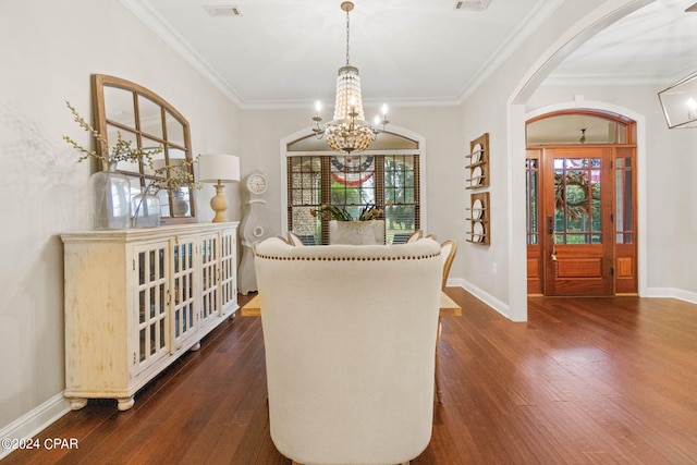 dining area featuring a healthy amount of sunlight, a chandelier, and dark hardwood / wood-style floors