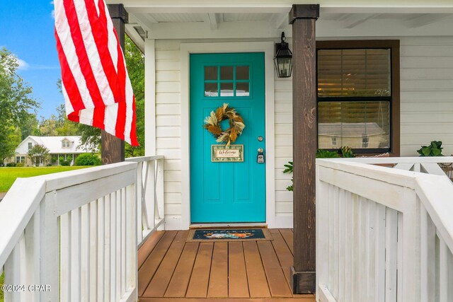 doorway to property featuring a porch