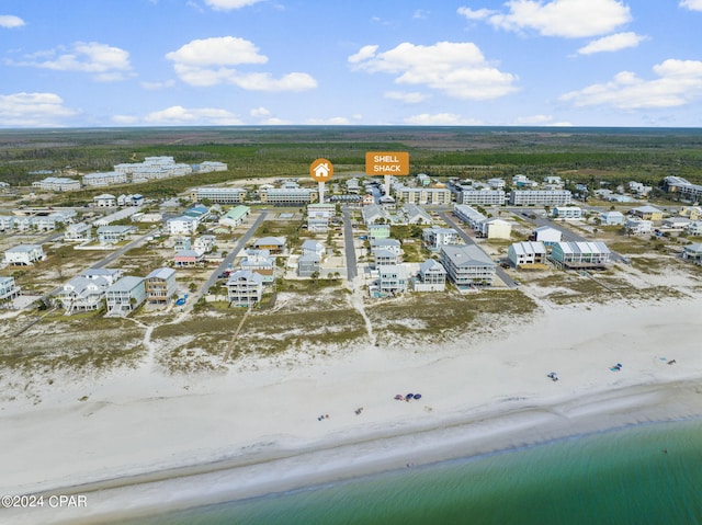 aerial view featuring a water view and a beach view