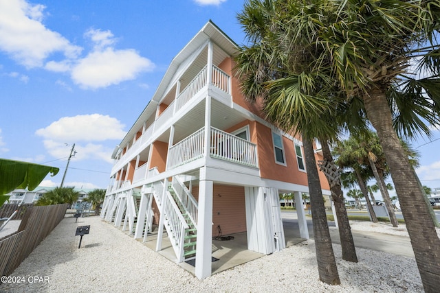 exterior space featuring a balcony and a carport