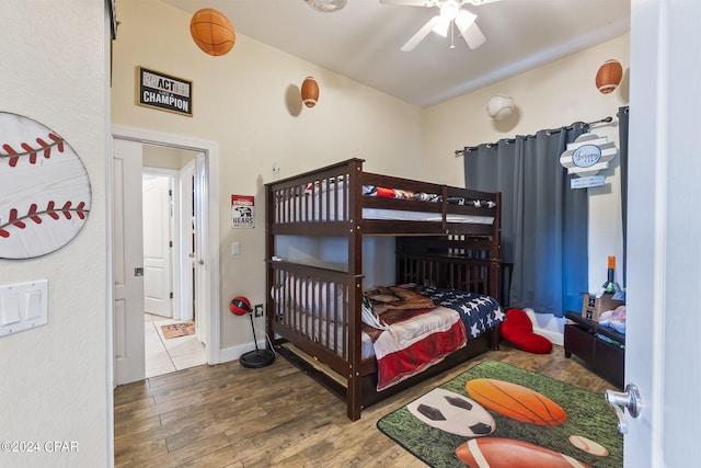 bedroom with wood-type flooring and ceiling fan