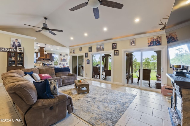 living room with crown molding, vaulted ceiling, ceiling fan, and a wealth of natural light