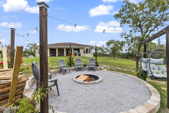 view of patio featuring a fire pit