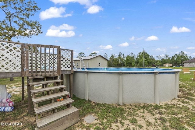 view of yard with a pool side deck