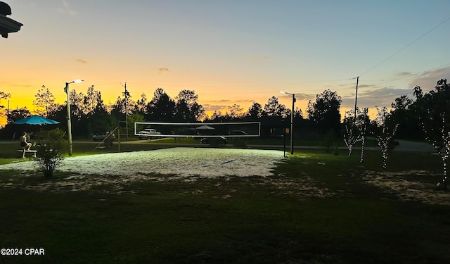 view of property's community featuring volleyball court and a yard