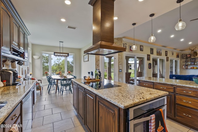 kitchen with pendant lighting, a kitchen island, island range hood, stainless steel appliances, and crown molding