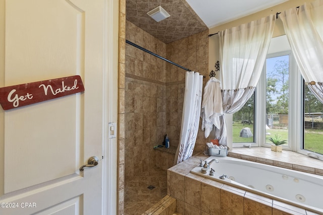 bathroom featuring separate shower and tub