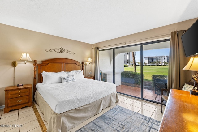 tiled bedroom featuring access to exterior