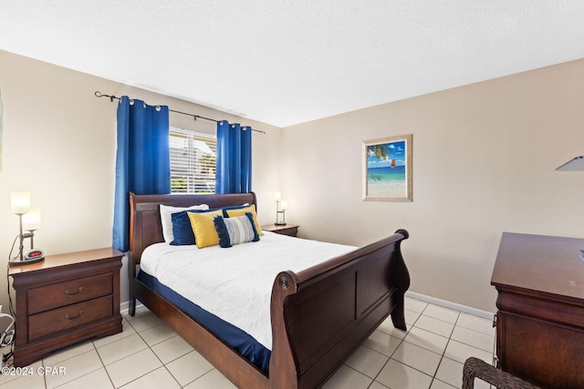 tiled bedroom with a textured ceiling