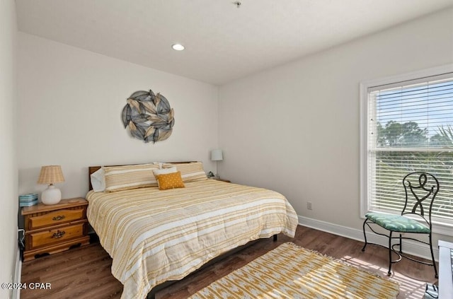 bedroom featuring dark hardwood / wood-style flooring