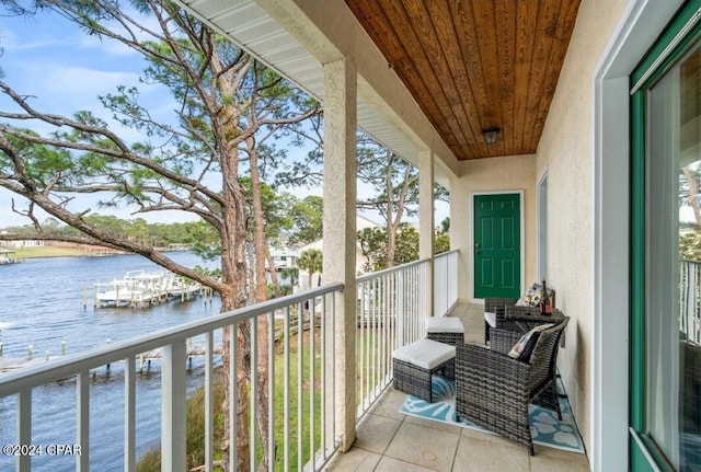 balcony featuring a water view